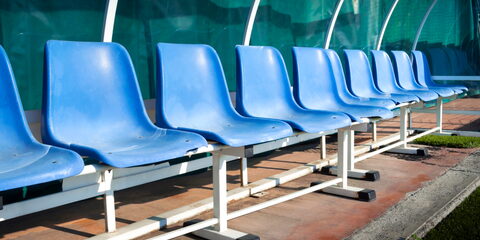 Coach and reserve benches in a soccer field